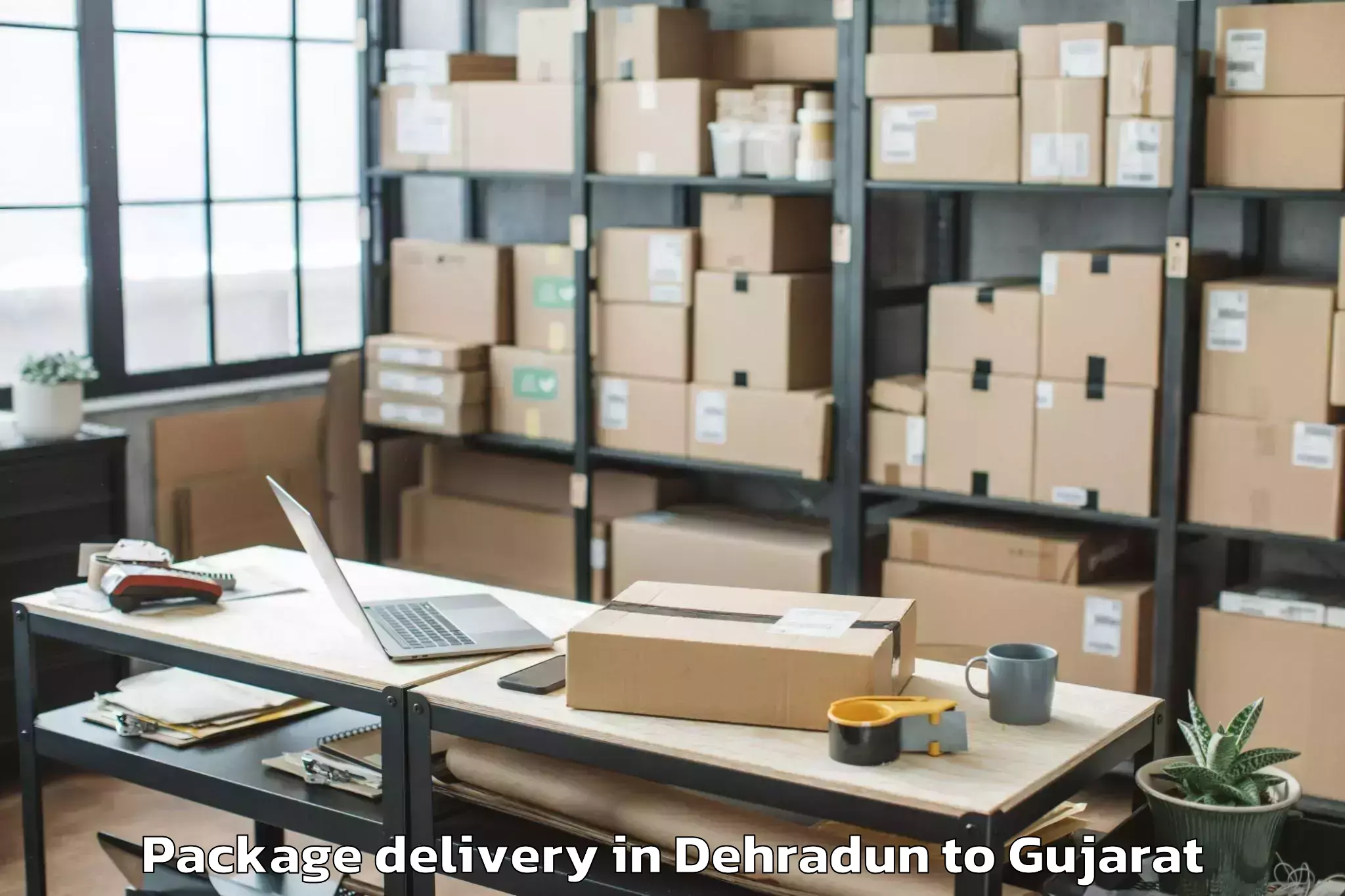 Trusted Dehradun to Karnavati University Gandhinag Package Delivery